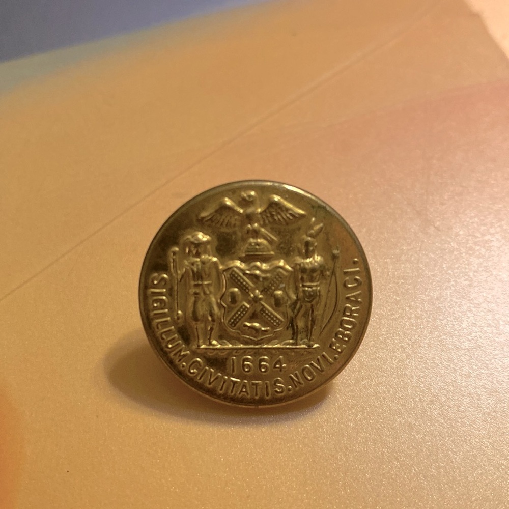 A vintage 1970s police button